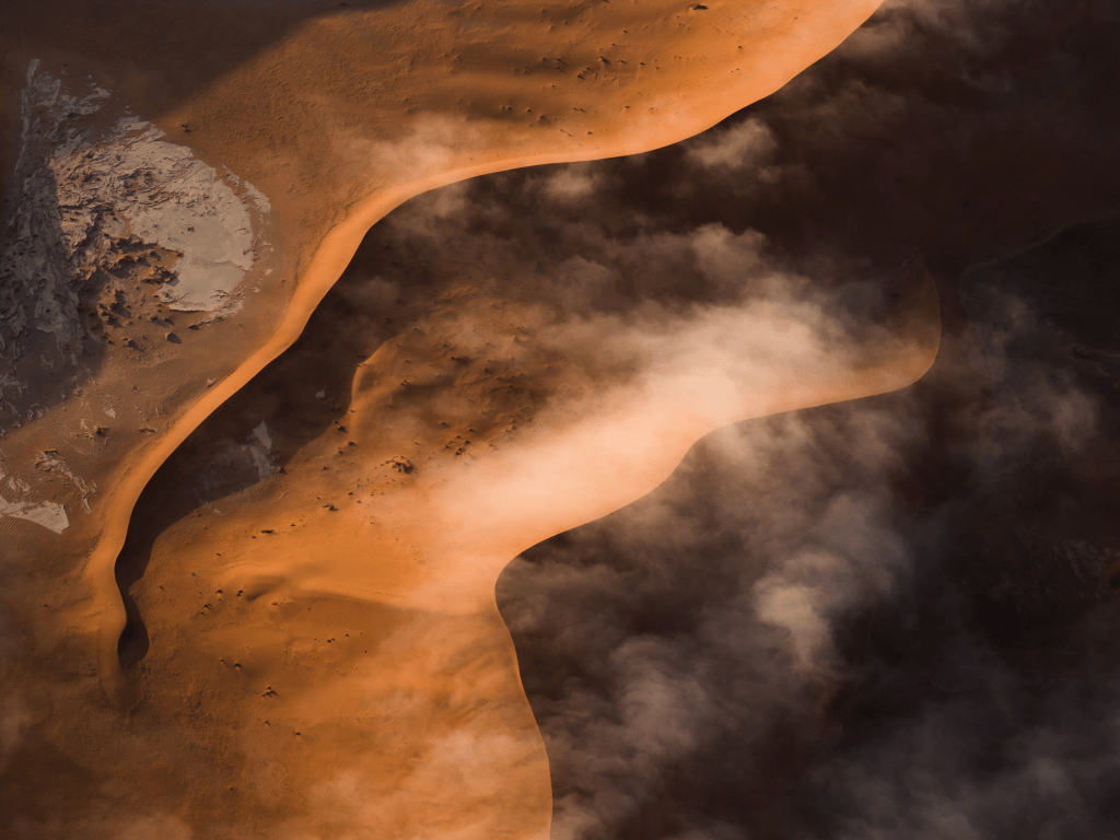 Golden dunes of the Namib Desert at sunrise in Namibia