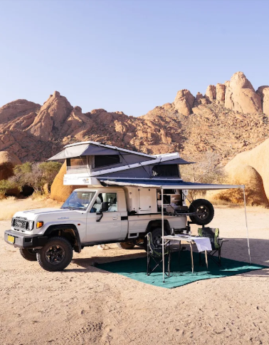 Camping vehicle with a rooftop tent in the Sossusvlei area, Namibia