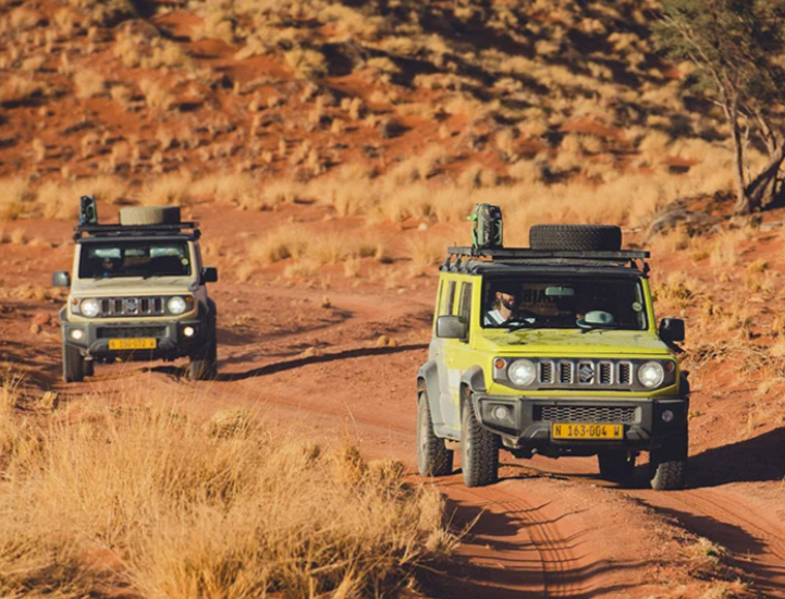 Suzuki Jimny driving on red Kalahari sand, Namibia